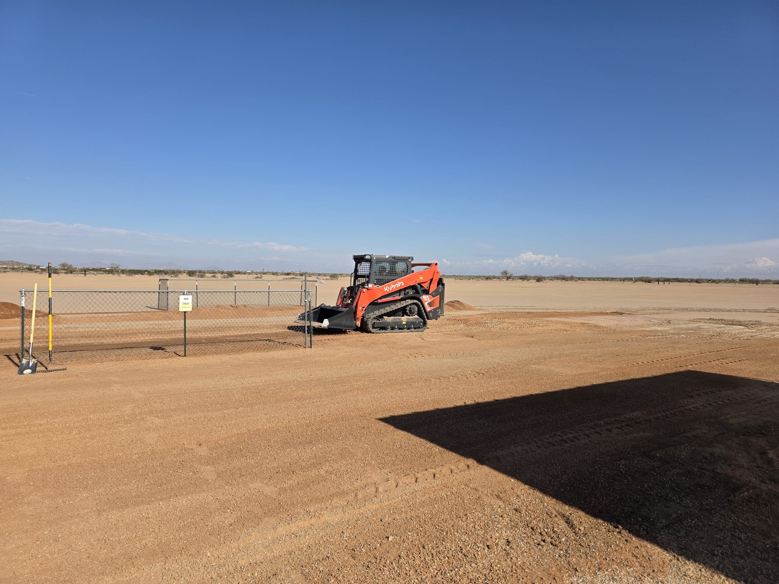 Kubota track loader on the pit area dirt lot at the Arizona City Flyers field